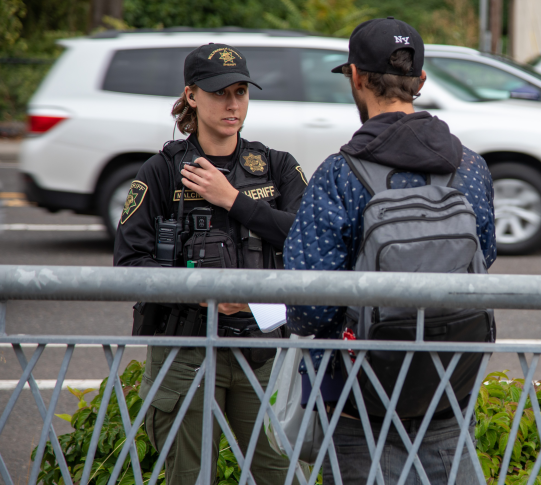 Deputy talks with a person