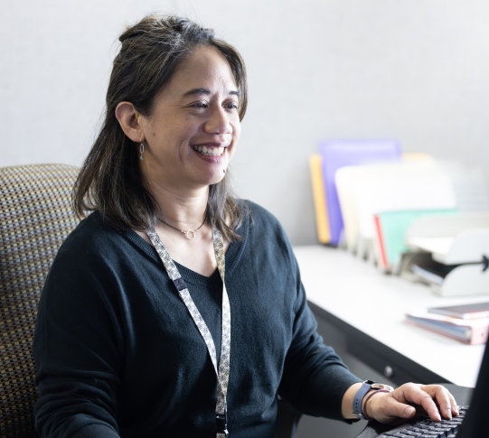 Human Resources employee sitting at their desk.