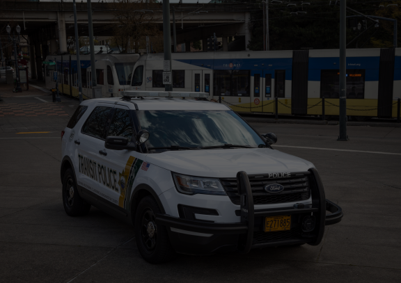 Transit Patrol car parked by MAX station platform.