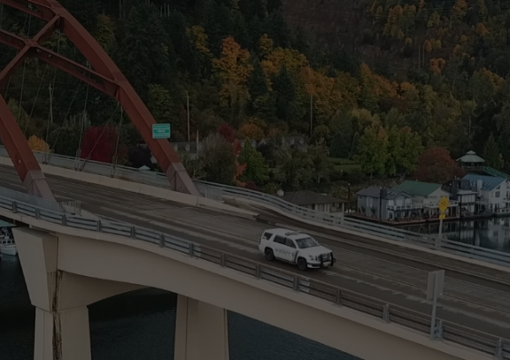 Patrol car crossing the Sauvie Island bridge.