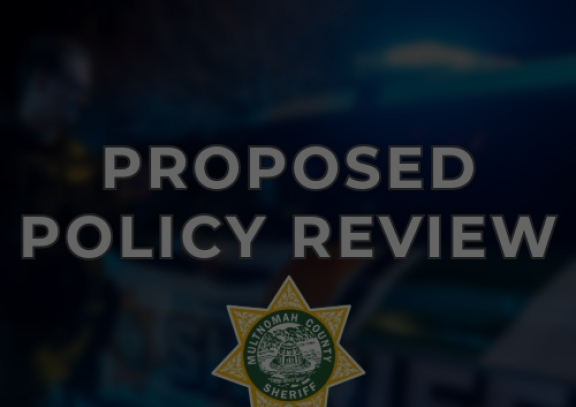 A patrol vehicle in the background with the words Proposed Policy Review in the foreground and the Multnomah County Sheriff's Office badge
