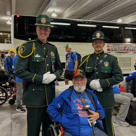 MCSO Sgt. Bryan White (left) and Captain Lance Hemsworth (right) represent the MCSO Honor Guard at the Honor Flight reception.