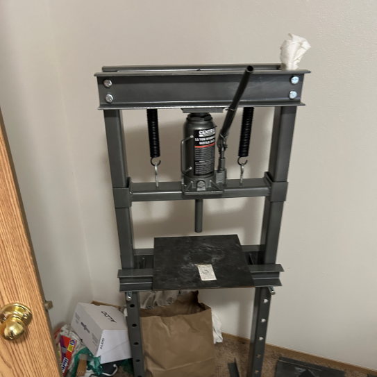Drug press seized at the apartment.