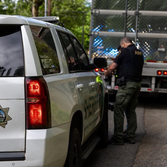 Deputy Kaiser helps a truck driver find an alternate route to prevent damage to the Stark Street Bridge.