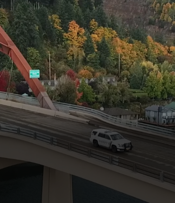 Patrol car crossing the Sauvie Island bridge.