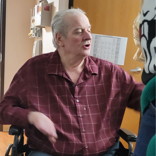Missing endeangered man, Reed Christenson, sitting in a wheelchair.
