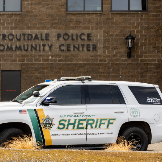 An MCSO patrol vehicle is parked in front of a building with the sign Troutdale Police Community Center