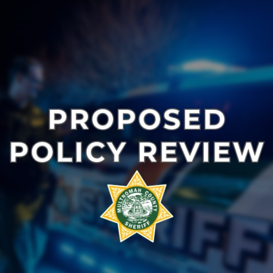 A patrol vehicle in the background with the words Proposed Policy Review in the foreground and the Multnomah County Sheriff's Office badge