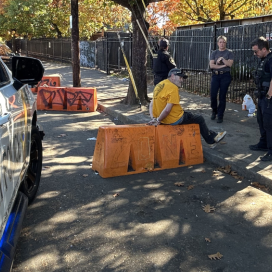 Transit Police on a mission with suspect on sidewalk