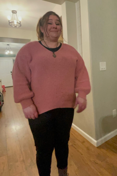 Photo of missing woman Erin Thornton in pink sweater and black pants.