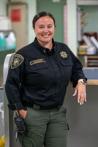 Lt. Lauren Baker stands next to the Multnomah County Detention Center Classification Unit desk.