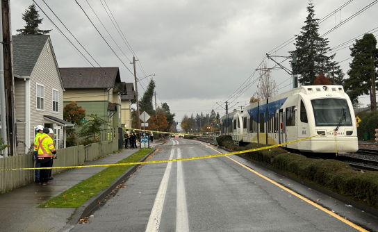 Yellow tape blocks the road during deadly crash investigation.