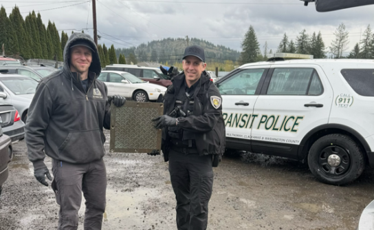 MCSO and Port of Portland Police hold a recovered stolen brass plate following a search warrant (MCSO photo)