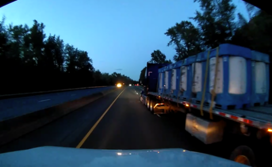 A screenshot from a dash camera video showing the moments leading up to a crash. 