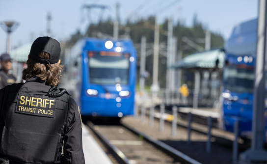 Transit Police at TriMet station with MAX approaching