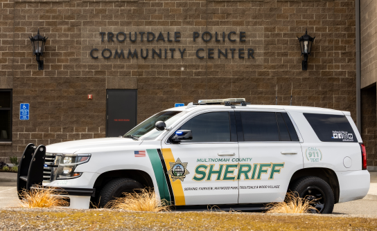 An MCSO patrol vehicle is parked in front of a building with the sign Troutdale Police Community Center