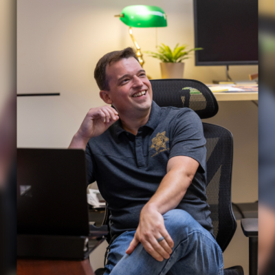 Detective Jonathan Zwick of the Multnomah County Sheriff's Office Detective Unit sits at his desk.